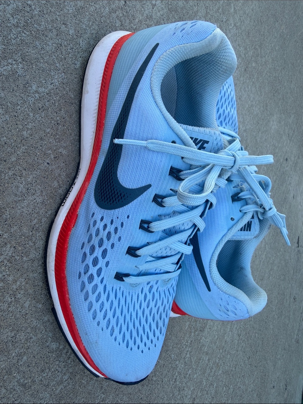 Nike Light Blue Athletic Sneakers with Navy Swoosh and Coral Accent